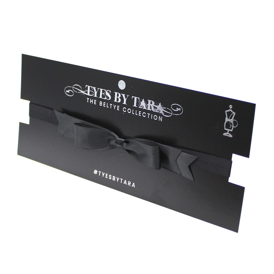Enchantress Black Bow Belt on Black Card Packaging View