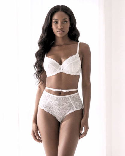White Queen Bow Belt on model in white lingerie in an elegant white boudoir