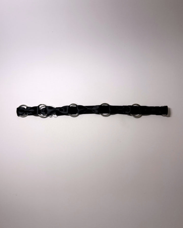 Runaway Black Bow Belt on softly lit surface