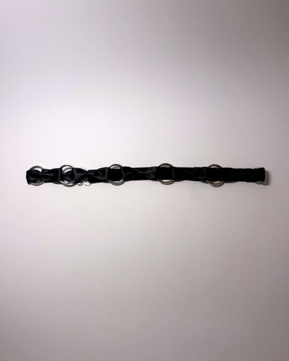 Runaway Black Bow Belt on softly lit surface