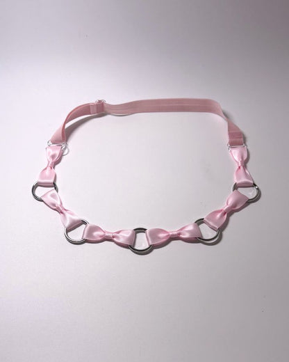 Runaway Pink Bow Belt on softly lit background