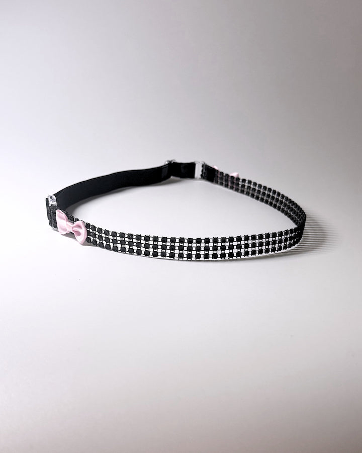 Vixen Sparkly Black Bow Belt showing. pink tye