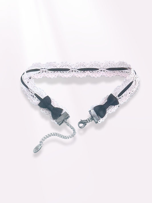 Chantilly Pink Lace Choker with Black Bows on light pink background showing bows