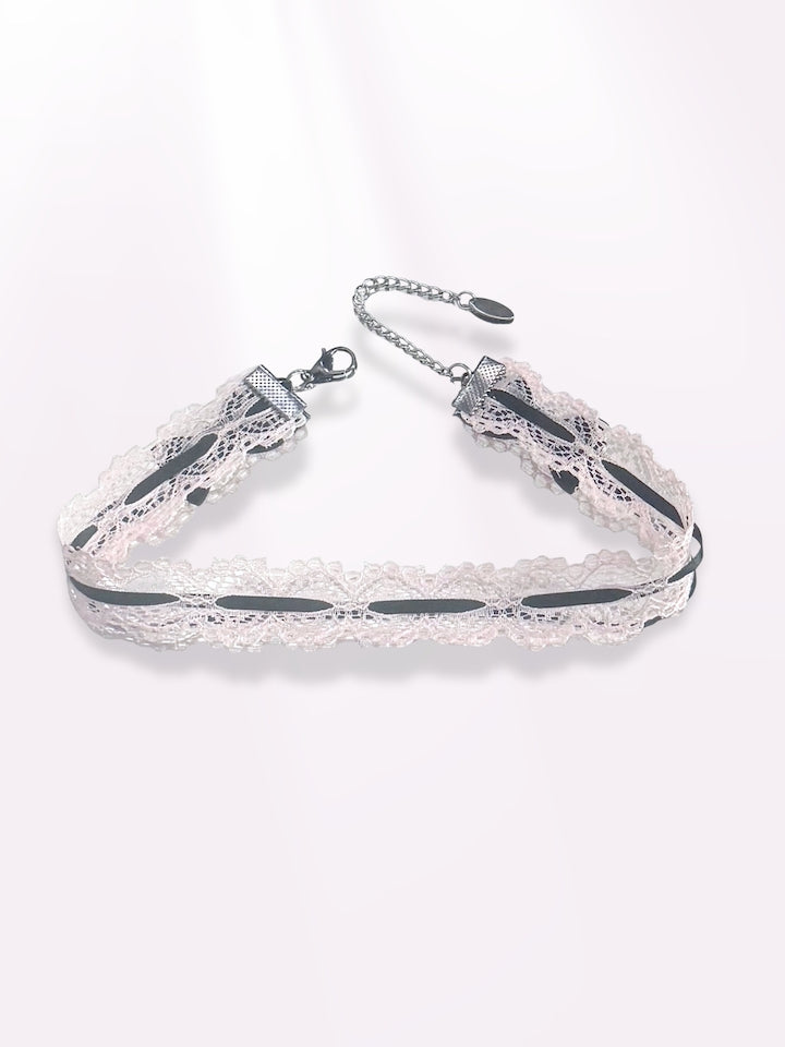 Chantilly Pink Lace Choker with Black Bows on light pink background