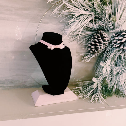 Highness Pink Bow Choker on black stand