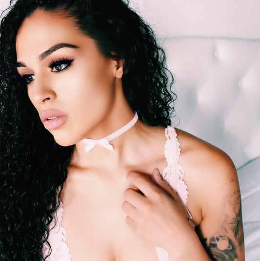 white velvet bow choker on beautiful model in pink lingerie in white boudoir