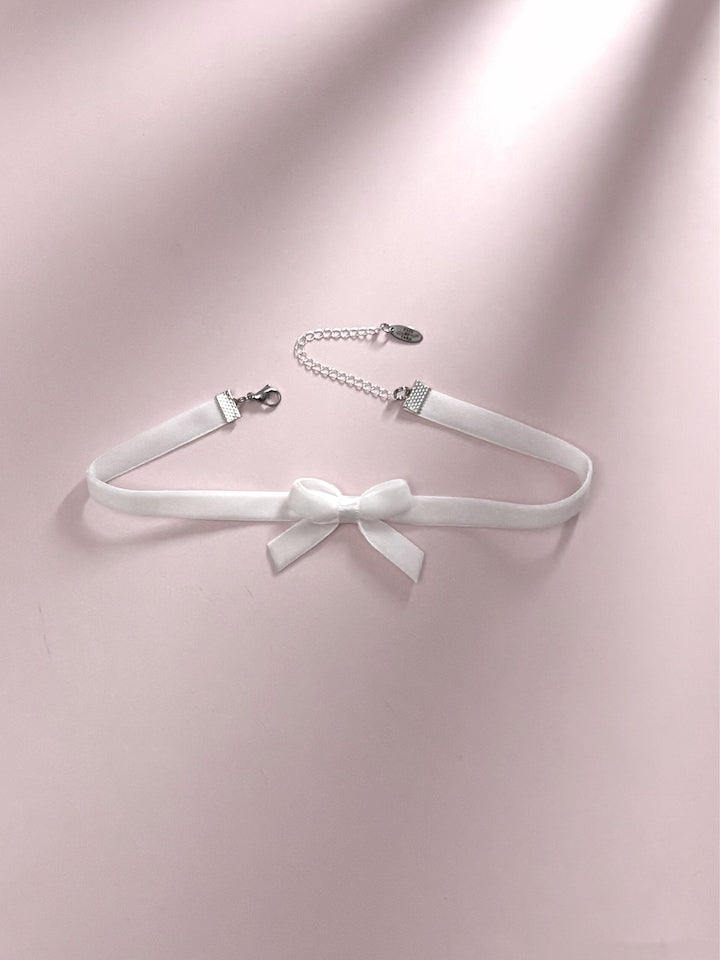 Marie Antoinette White Bow Choker on Pink Background