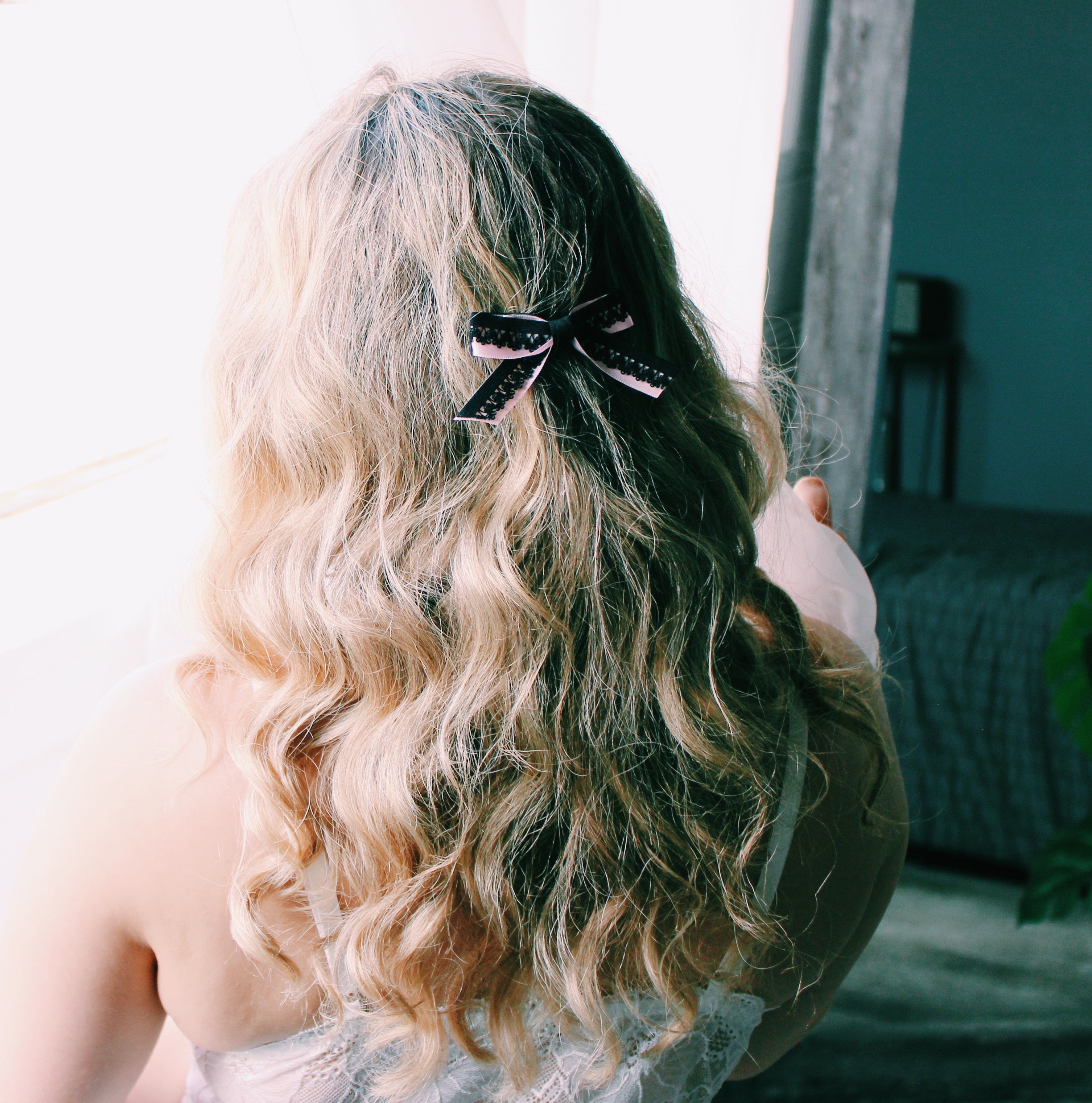 Blonde Plus Size Model Wearing Black and Pink Hair Bow