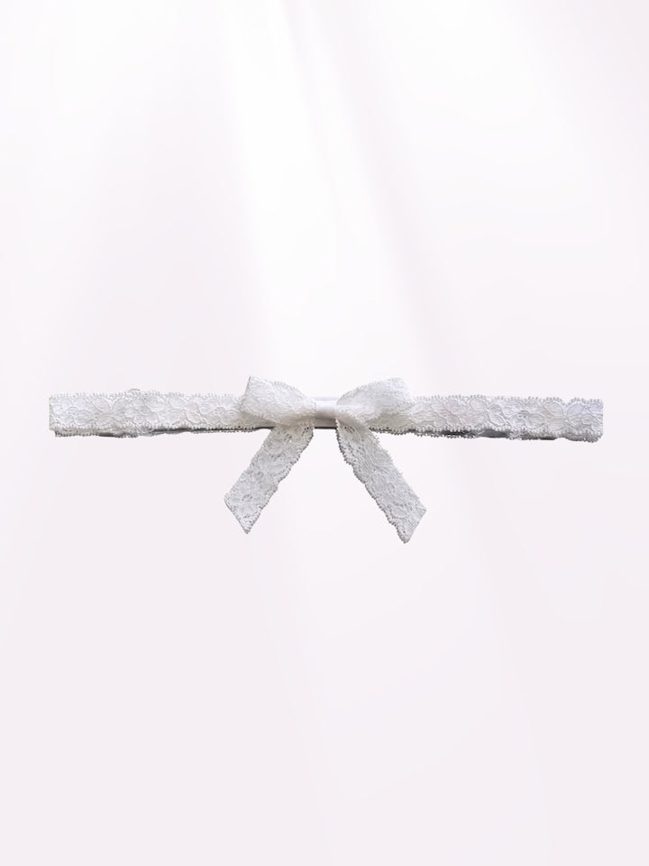 Bougee White Lace Bow Belt on Light Pink Background