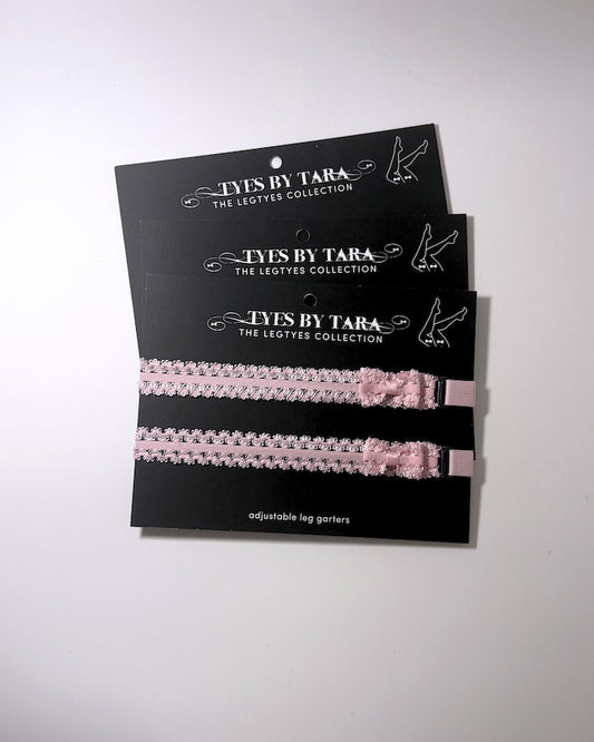 Lady Pink Elastic Leg Garters with soft adjustable straps on gray background 3 pack