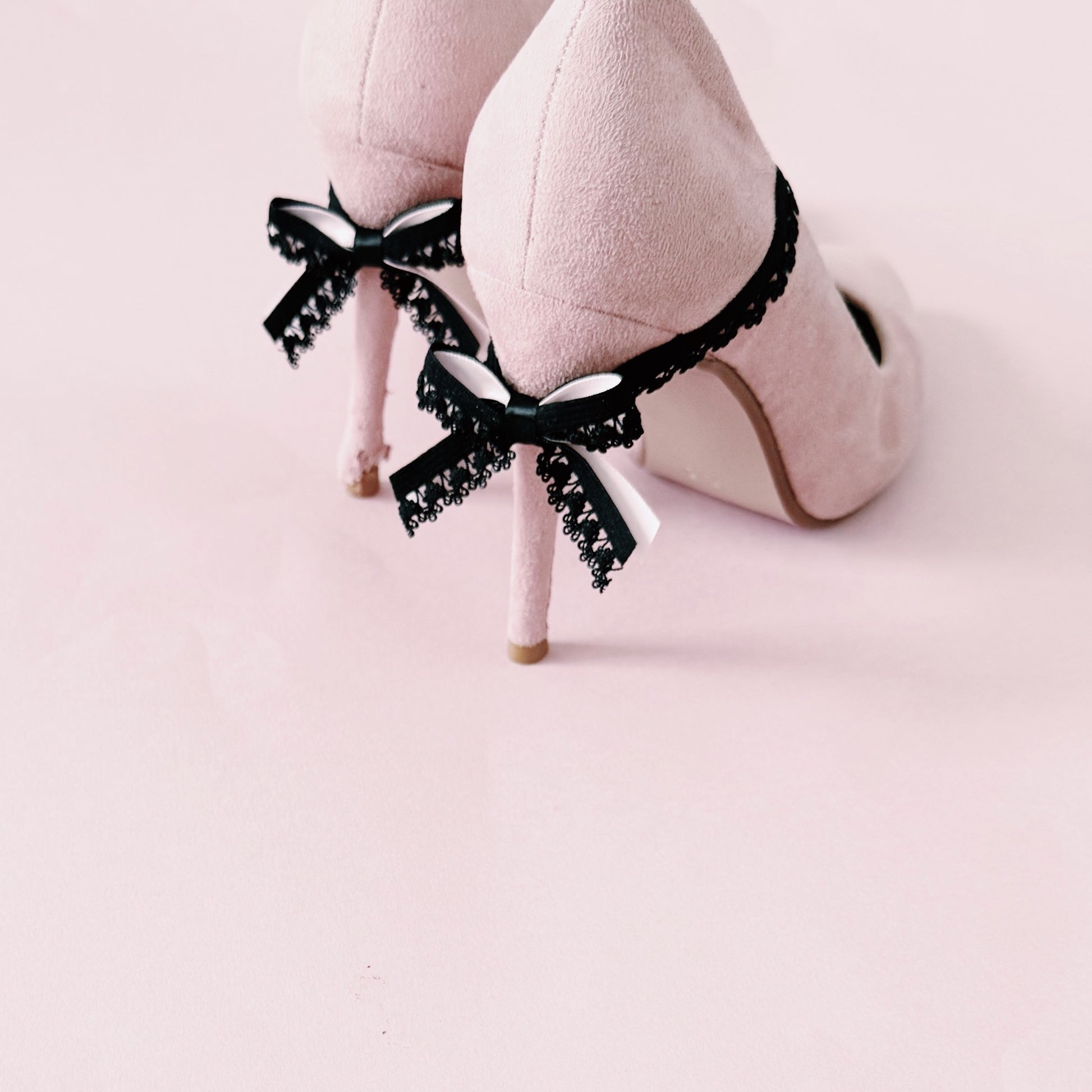 Belle Black Bow Heel Straps on Light Pink Heels