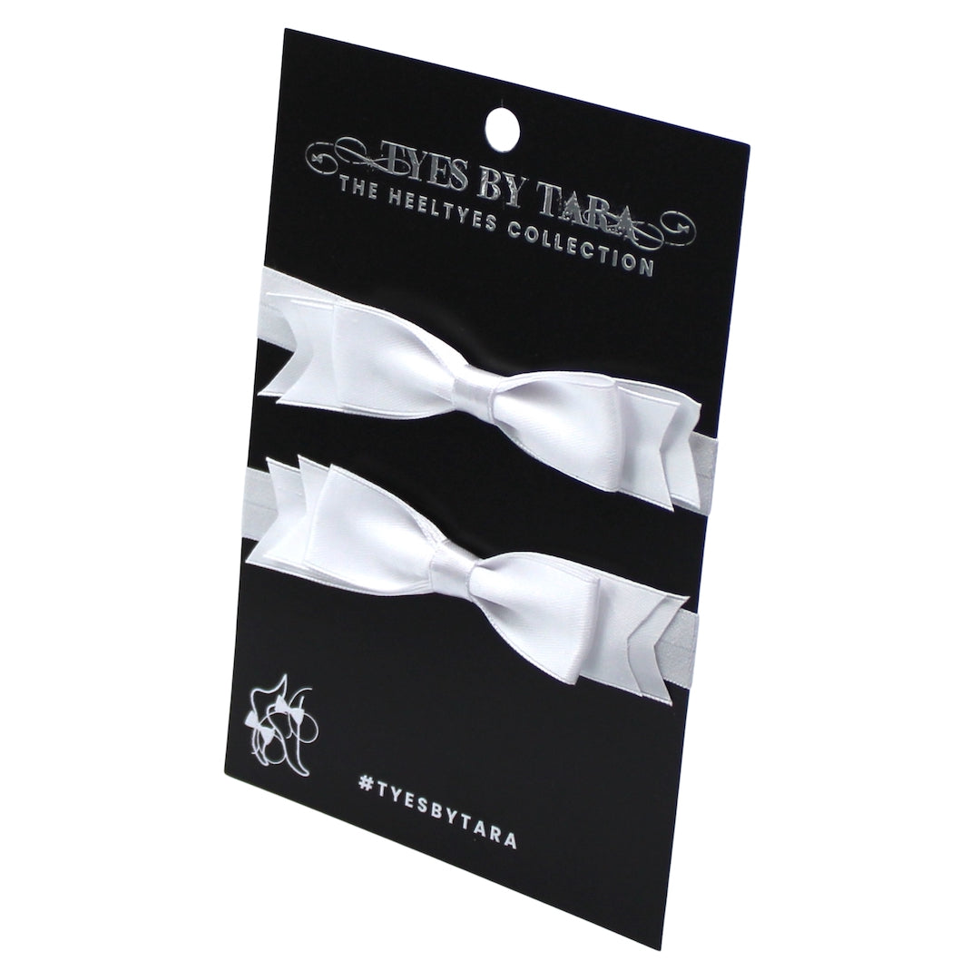 White Bow Heel Straps on Black Card