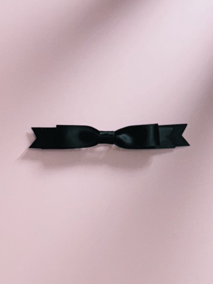 Enchantress Black Hair Bow on Pink Background
