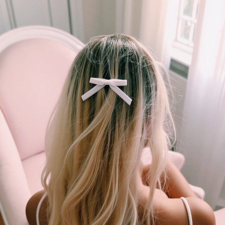 white velvet hair bow on beautiful blonde model