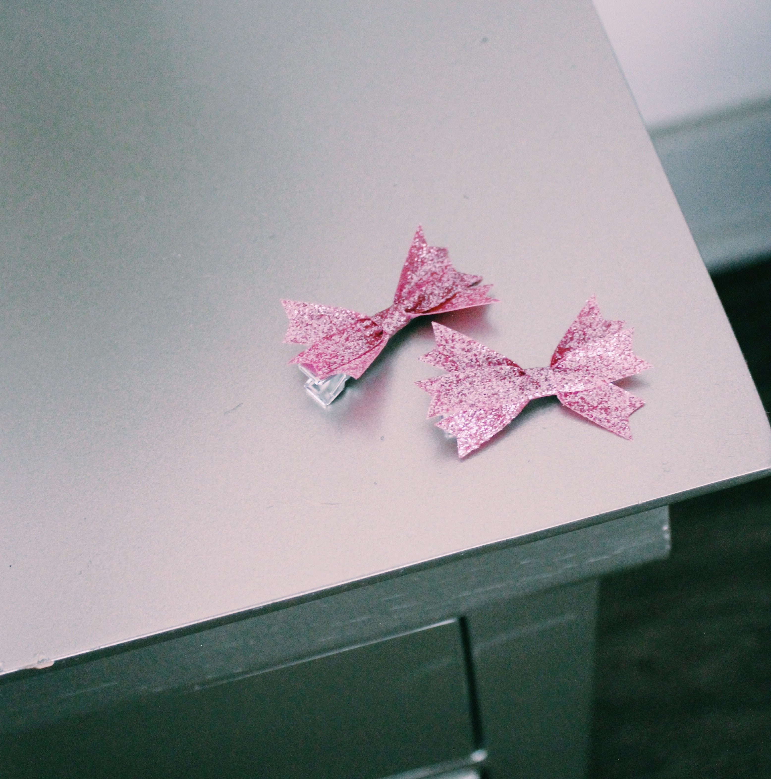 Pink Starlet Hair Clips on Nightstand