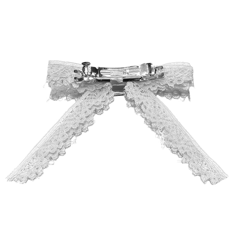 back view of barrette of white lace hair bow on white background
