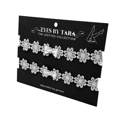 White Flower Leg Garters on Black Card on a white background