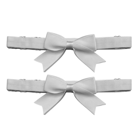 white bow leg garters on white background