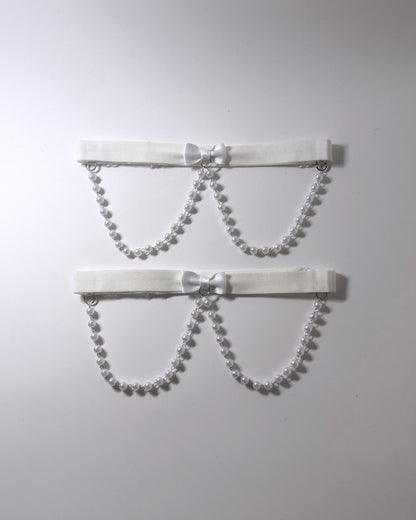 White Pearl Leg Garters Two white elastic  garters with pearl bead chains and small white bows, displayed against a plain light gray background. 