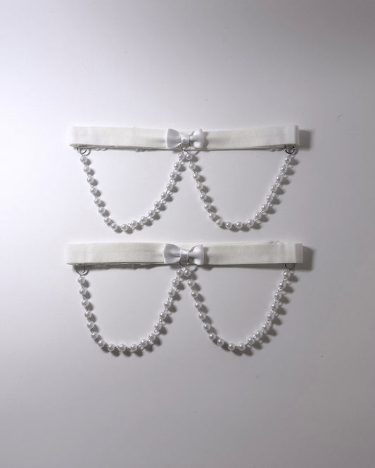 White Pearl Leg Garters Two white elastic  garters with pearl bead chains and small white bows, displayed against a plain light gray background. 