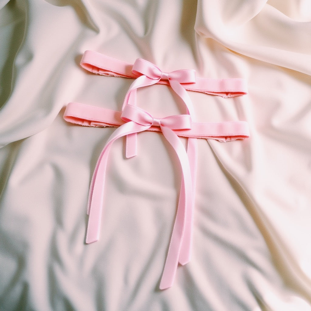 Doll Pink Bow Leg Garters on Ivory Satin Sheet