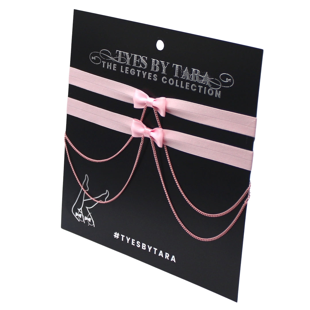 Pink Chain Bow Leg Garters on White Background on Black Card