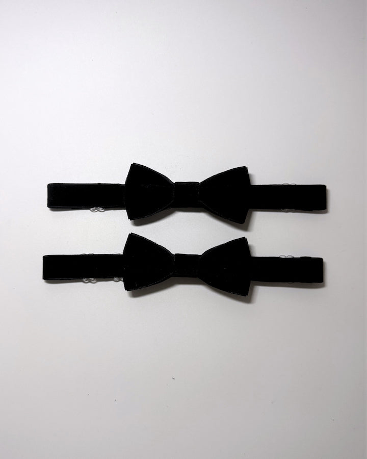 Black Velvet Bow Leg Garters on softly lit background
