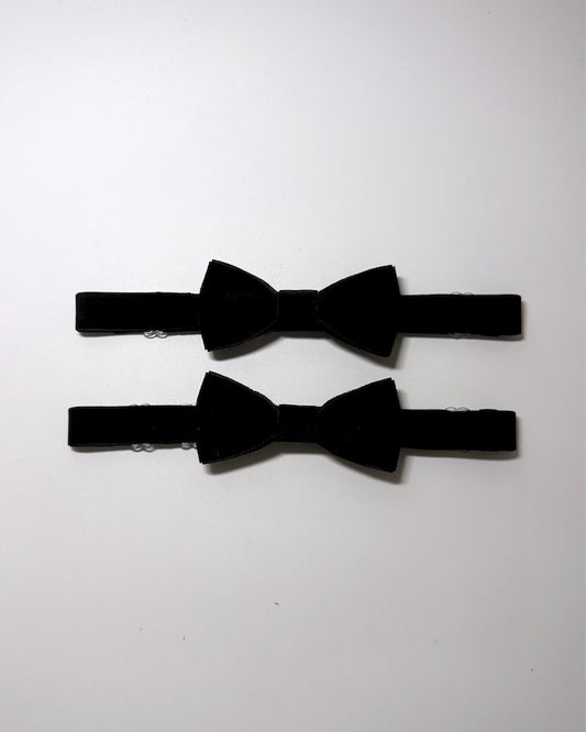 Black Velvet Bow Leg Garters on softly lit background
