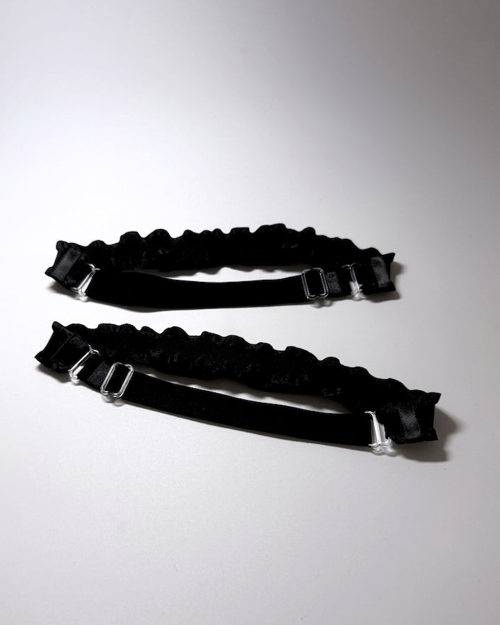 Maiden Black Ruffled Leg Garters with Bows showing the adjustable straps