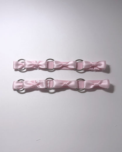 Pink Runaway O Ring Leg Garters on softly lit background