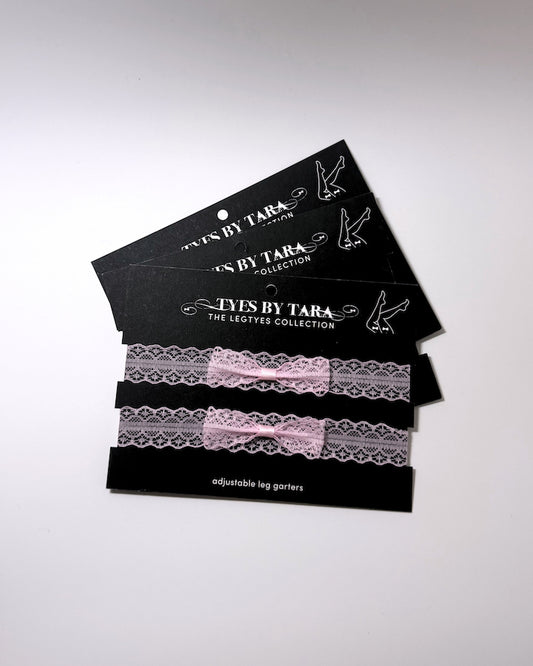 Siren Pink Lace Leg Garters on black cards shown as a 3 pack