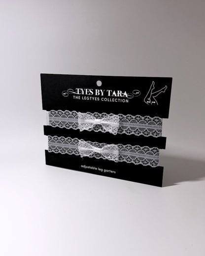 packaging view of siren white lace bow leg garters