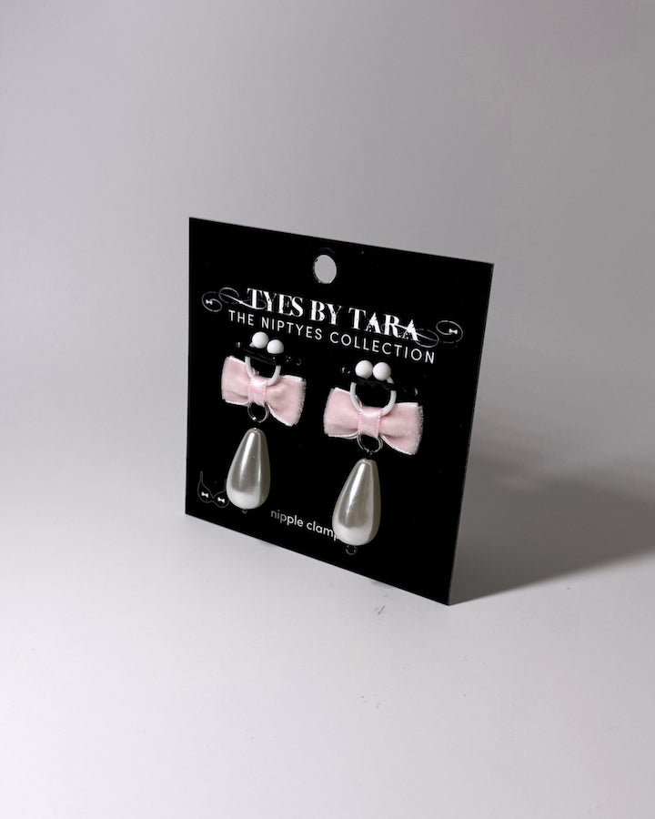 Madam Pink Velvet Pearl Nipple Clamps displayed on black card