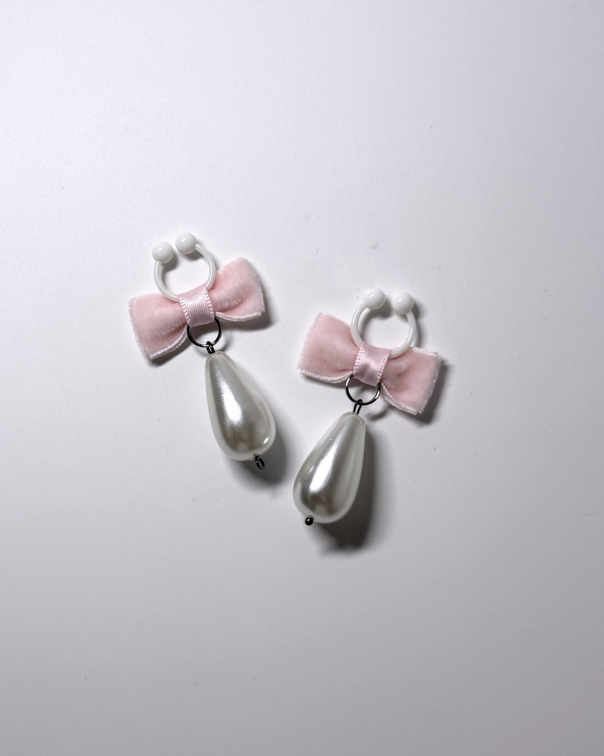 Madam Pink Velvet Pearl Nipple Clamps displayed on light gray background