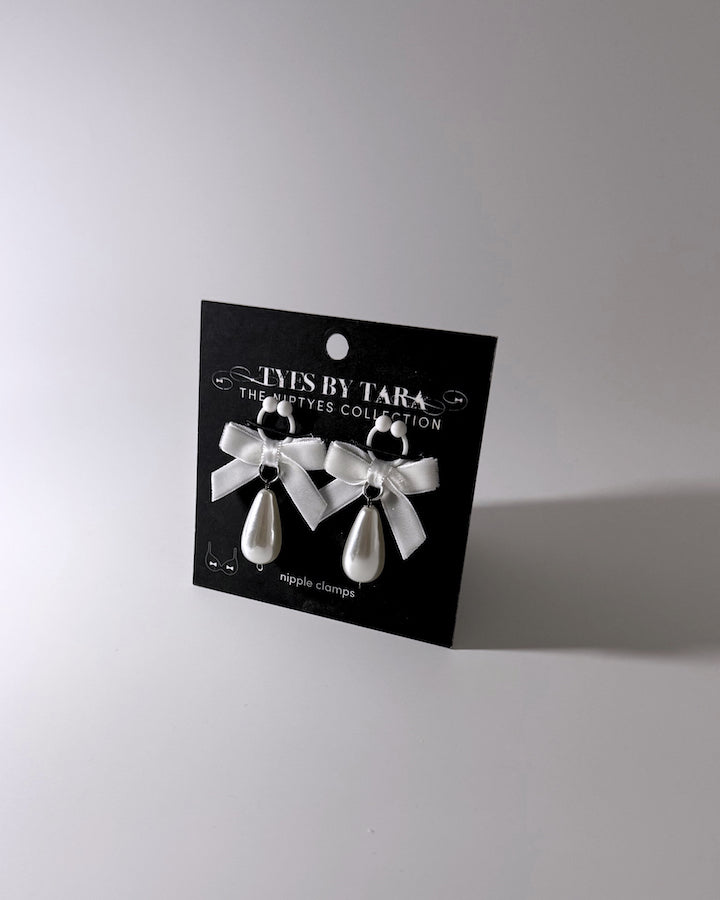 Marie Antoinette White Bow Pearl Nipple Clamps with Teardrop Pearls Packaging View on Black Card