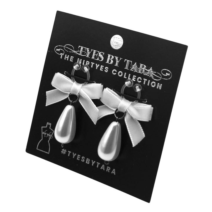 White Bow Pearl Nipple Clamps on Black Card