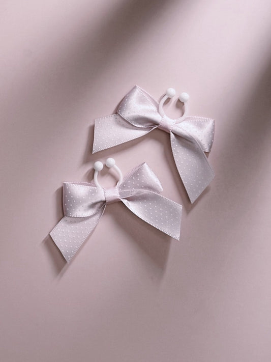 Pinup Pink Bow Nipple Clamps on Pink Background