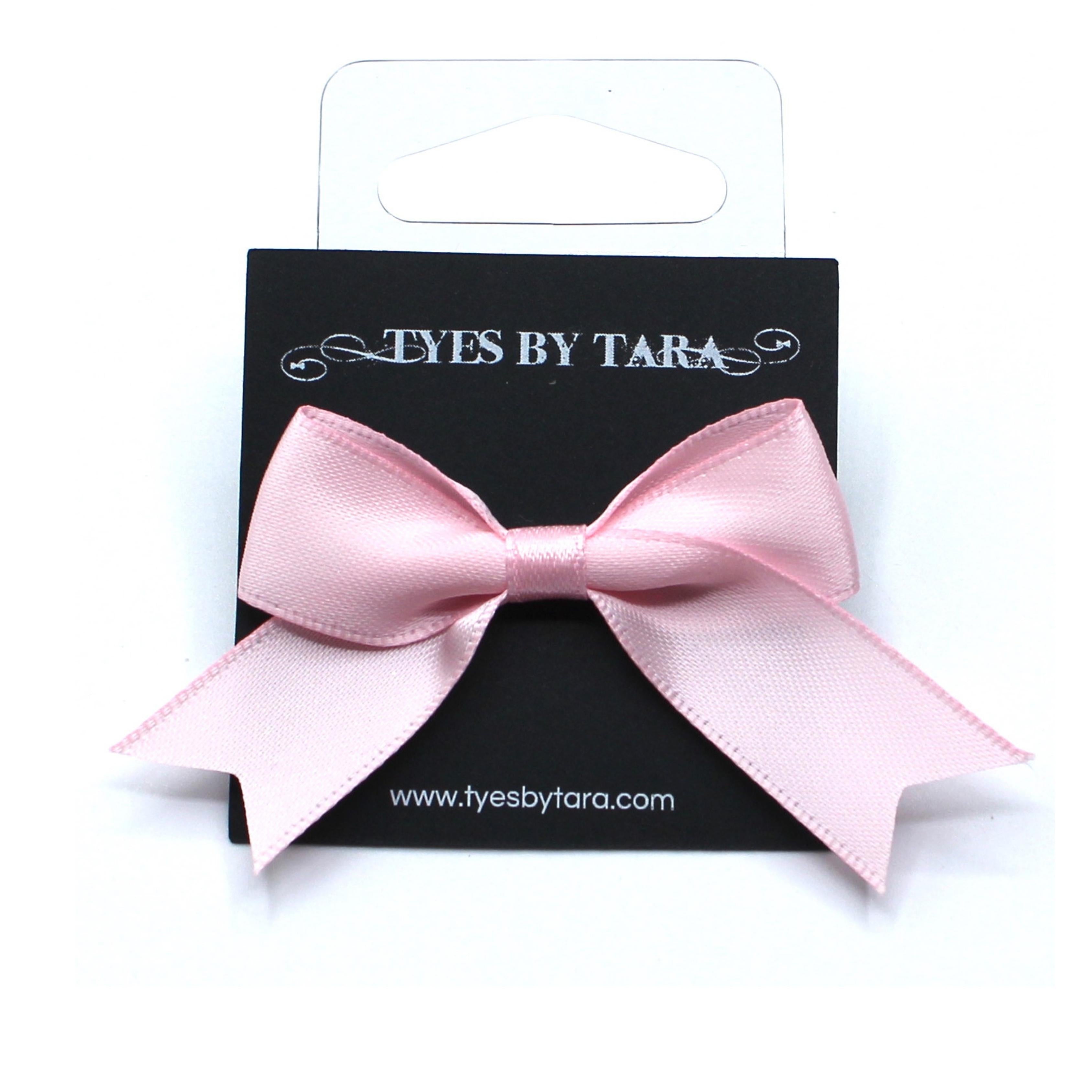 Pink Bow Ring with Silver Adjustable Ringband and Dovetail Accents on Black Merchandising Card