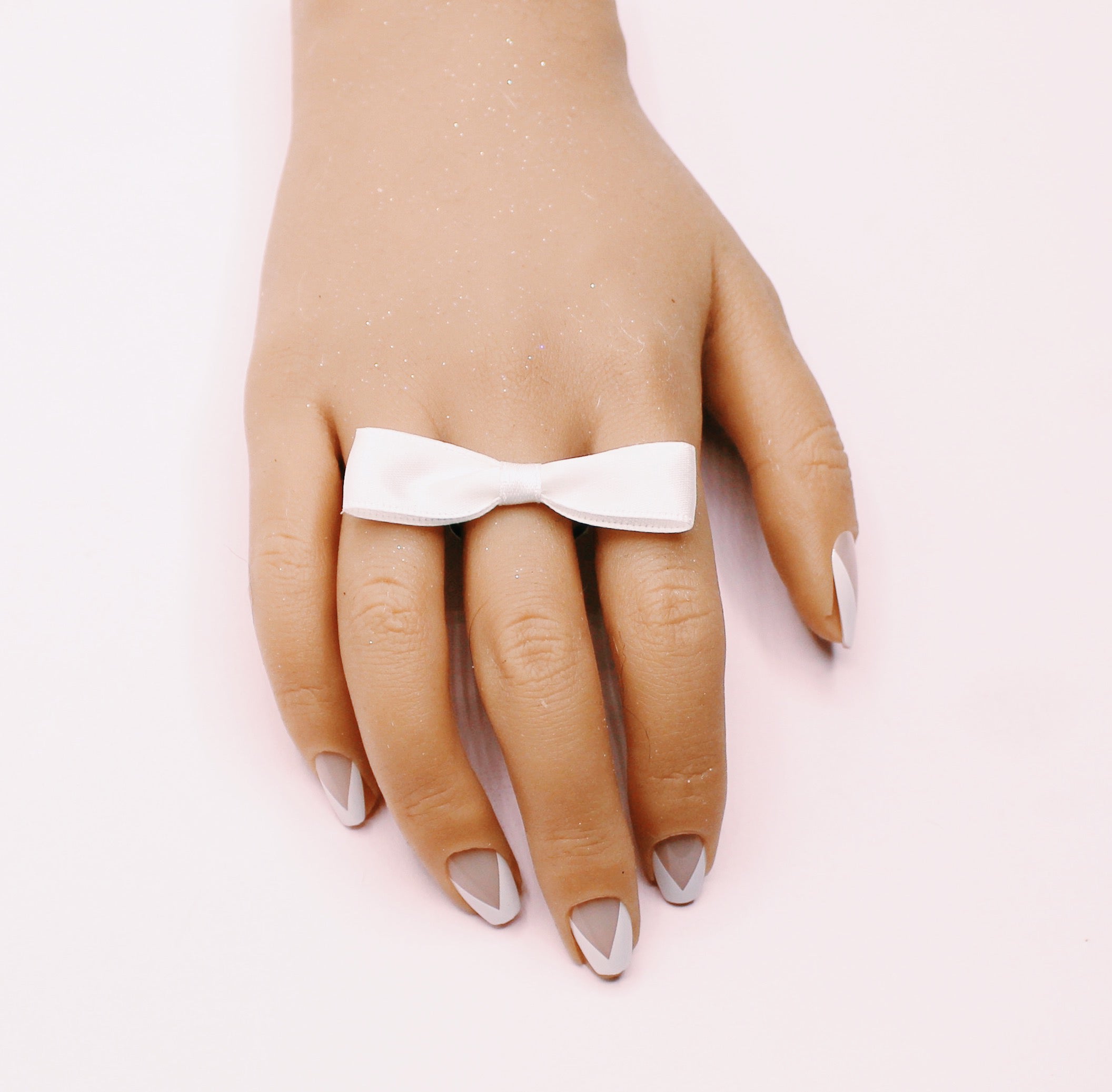 White Bow Ring on Model with French Manicure