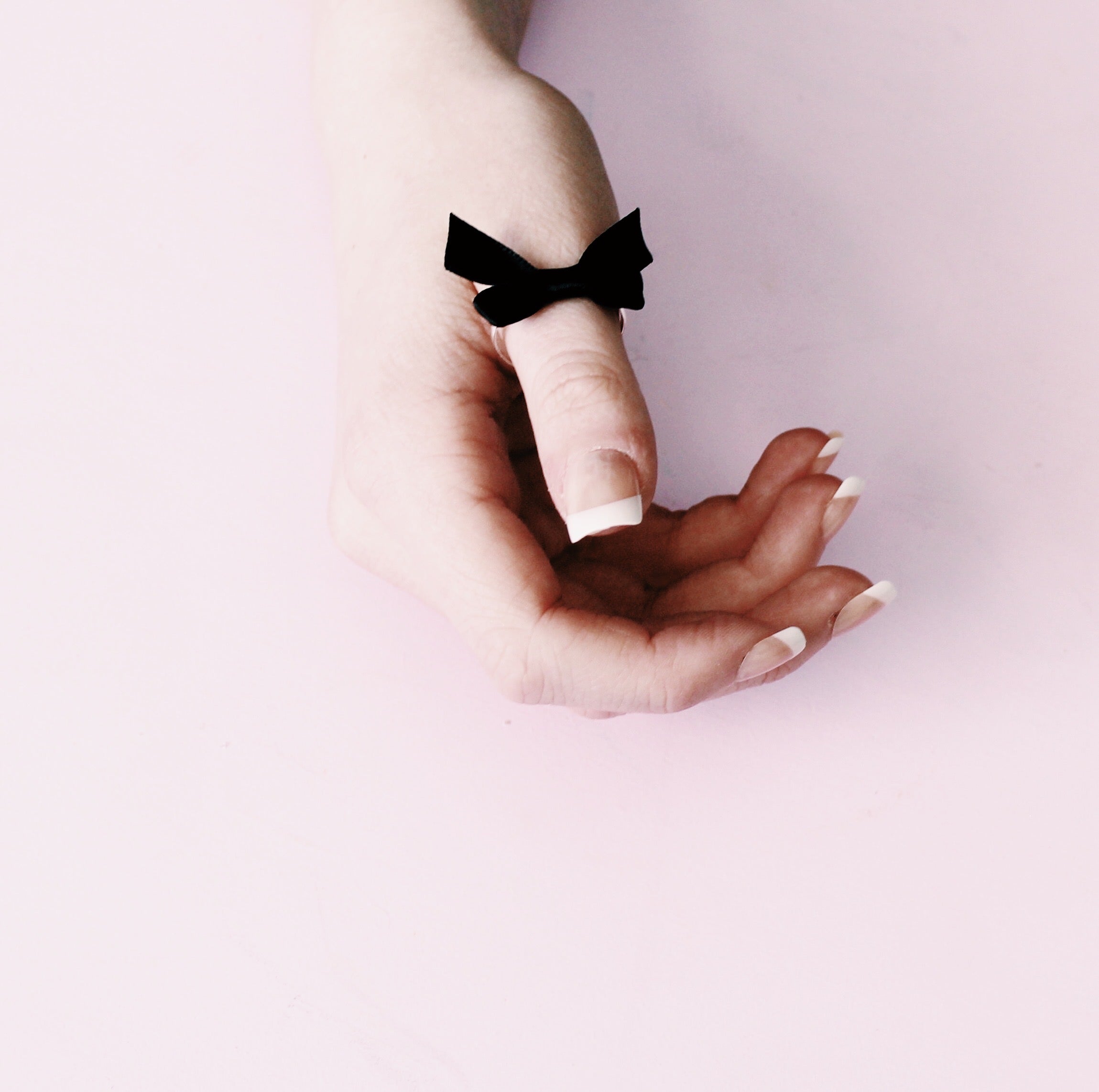 Black Bow Ring on Model with French Manicure