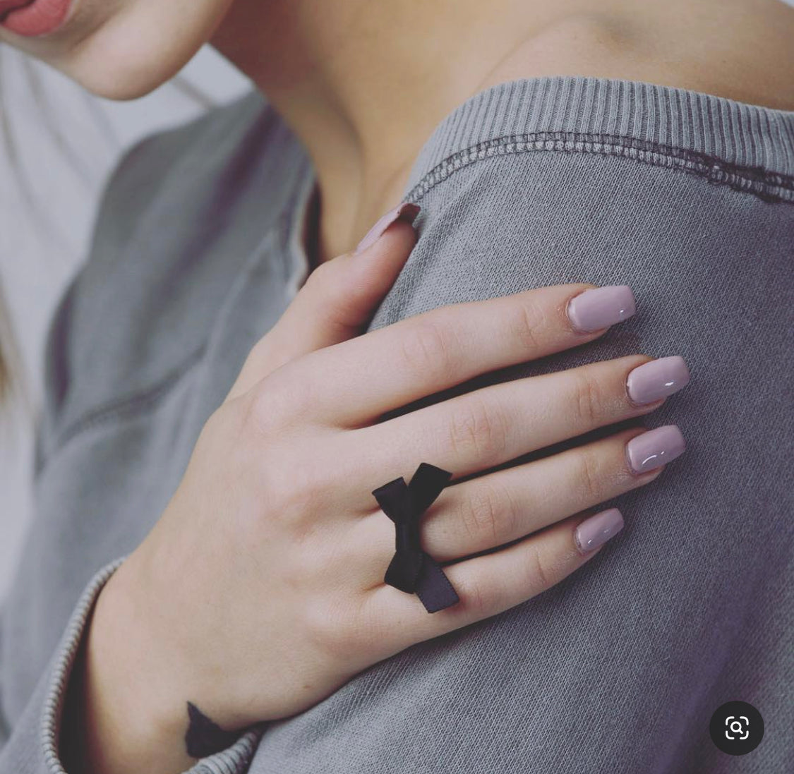Black Bow Ring on Model with Pink Nails