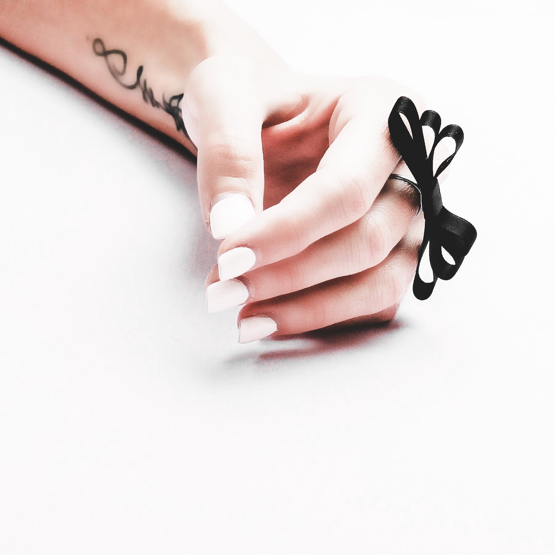 Black Bow Ring on Model with Tattoo