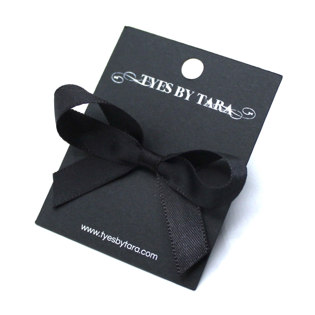 XO Black Bow Ring on Black Card