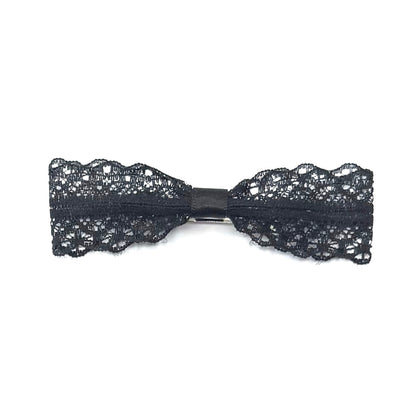 black lace hair bow on white background