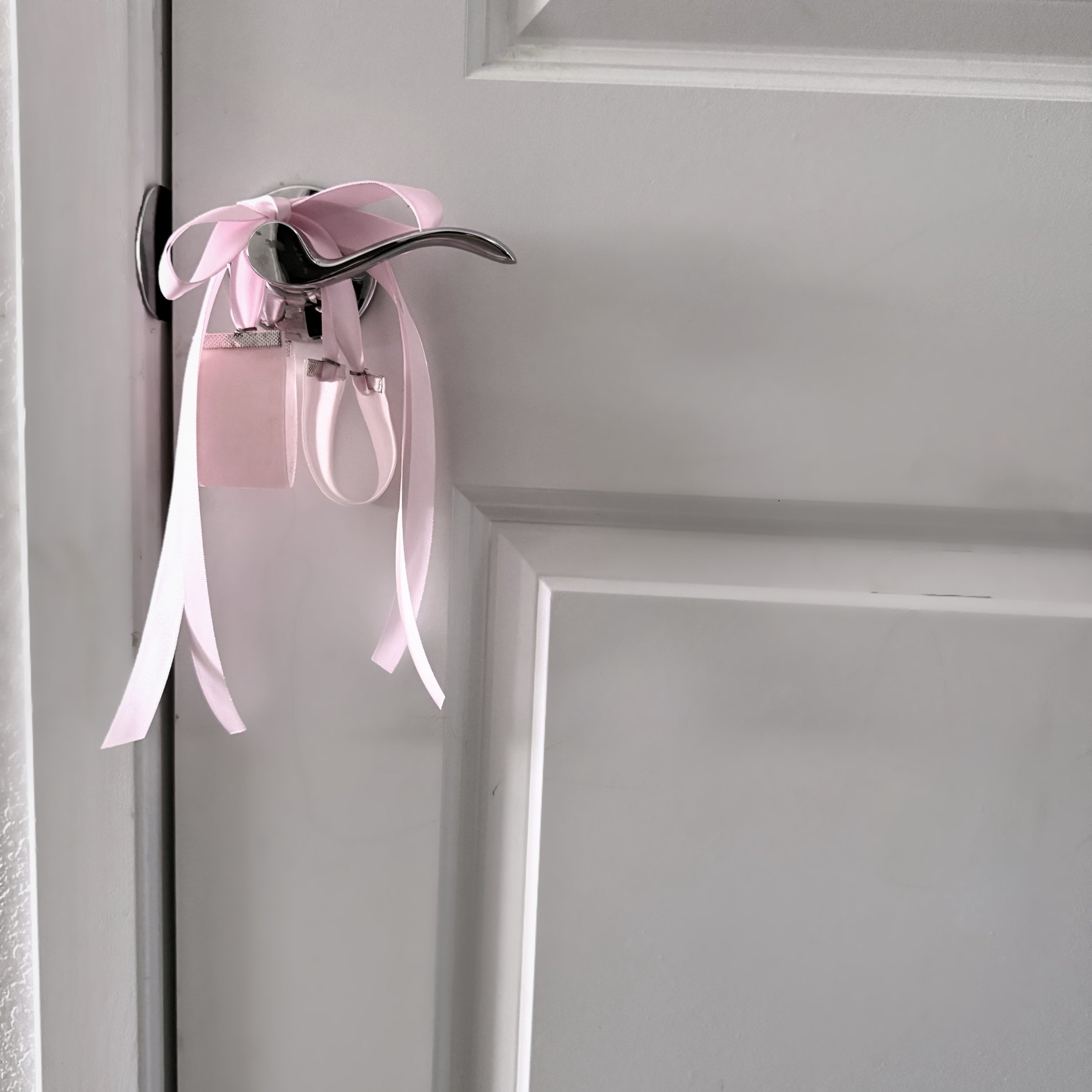 Marie Antoinette Pink Velvet Handcuffs on Door Knob