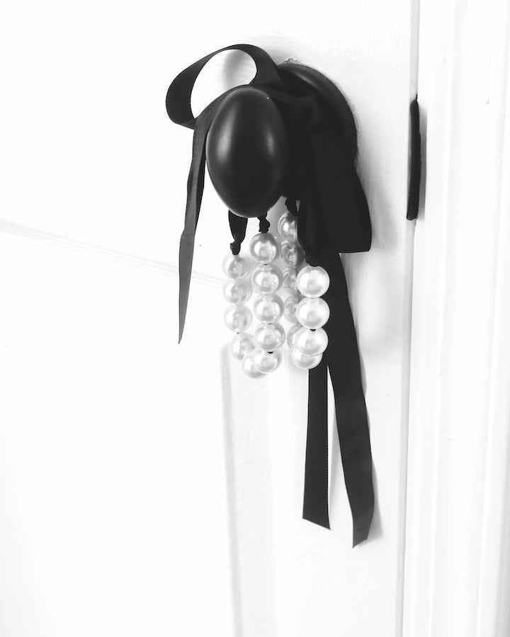 Mademoiselle Pearl Handcuffs on black door knob