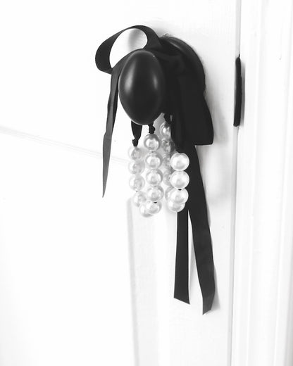 Mademoiselle Pearl Handcuffs on black door knob