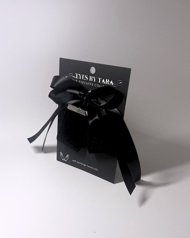 Madame Velvet Handcuffs on a Black Card