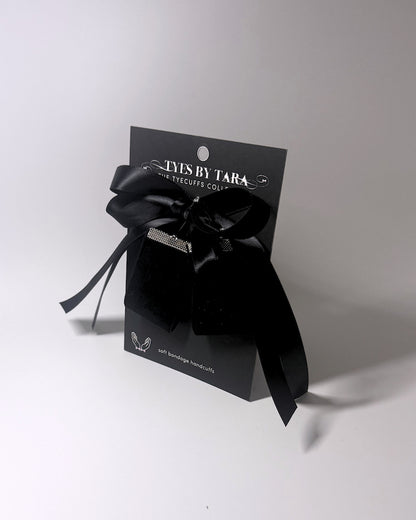 Madame Velvet Handcuffs on a Black Card