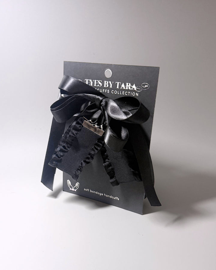 Black Ruffled Handcuffs with long satin ties on black card